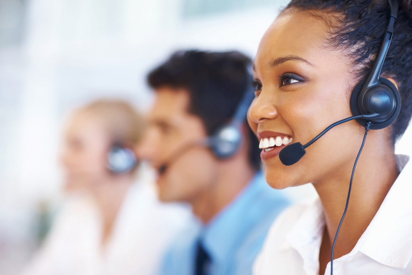 Colleagues Answering Service With Headset